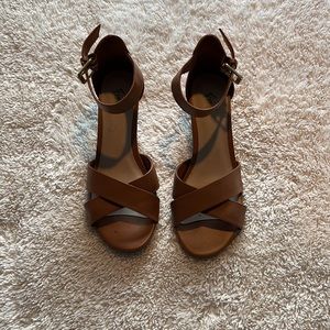 Size 8.5 light brown wedged sandals! Slightly used! Brand is Fioni!